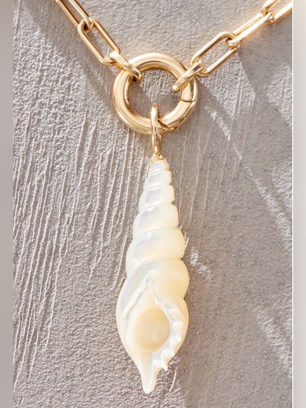 Maura Green spiral shell charm